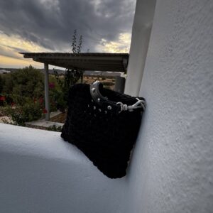 Black handmade crochet shoulder bag with studded handle