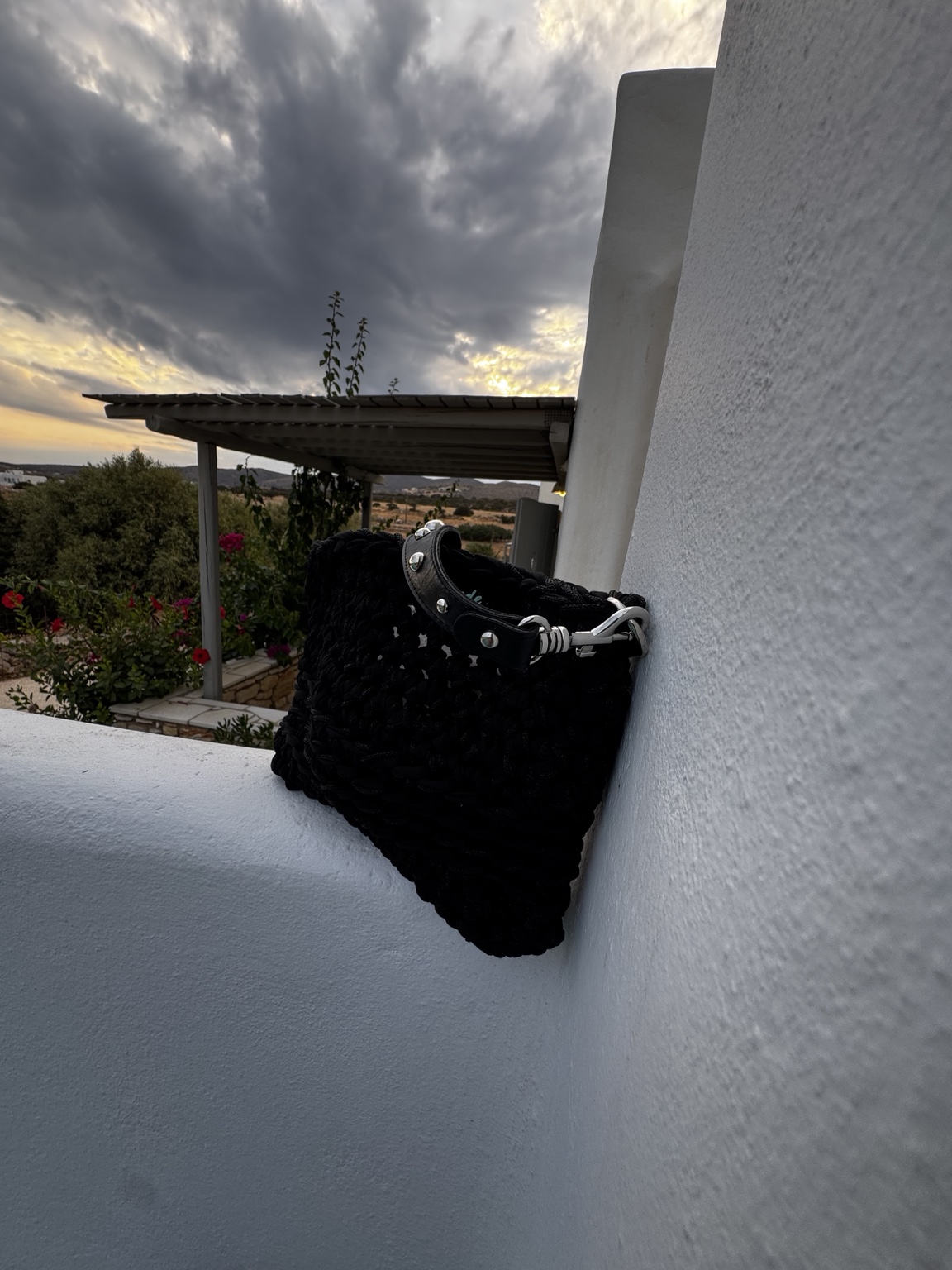 Black handmade crochet shoulder bag with studded handle